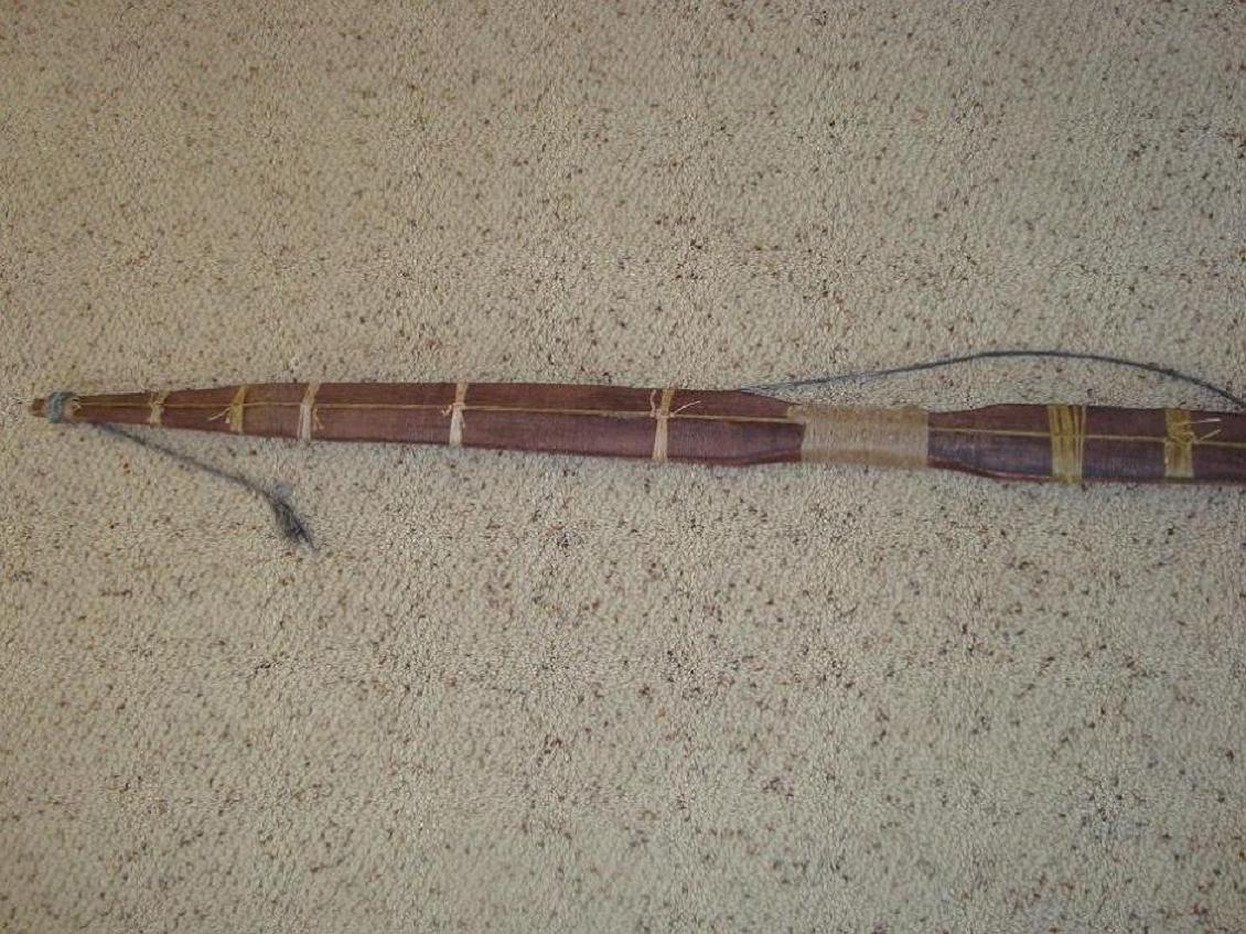 Cable-backed bow